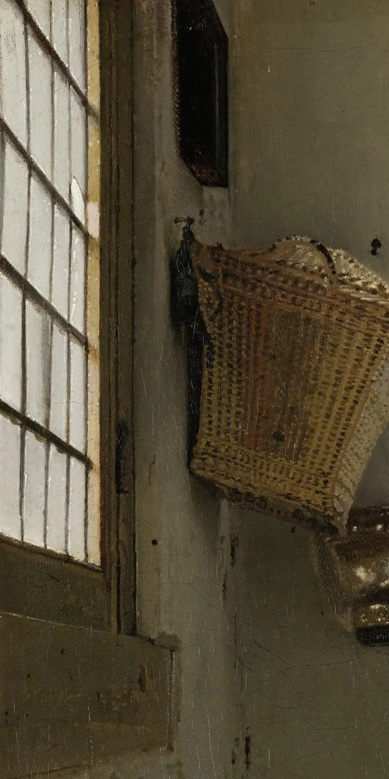 The window on the left wall: four dark glazing bars slant down to the right across the glass, above a lower rail and a board with a thin light top edge.